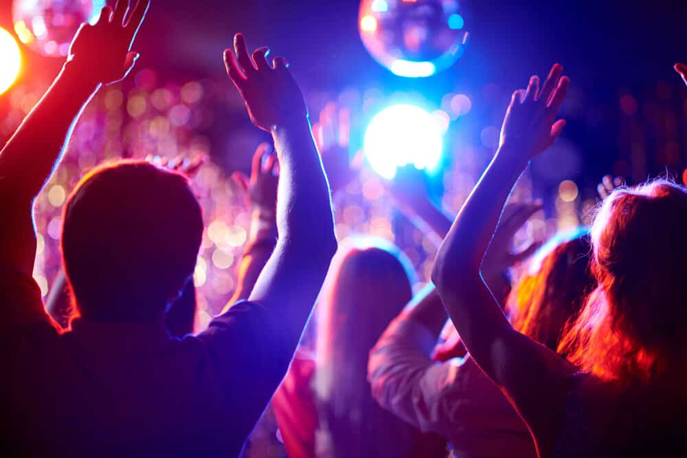 Dance A-group-of-people-waving-their-arms-in-a-dance-club